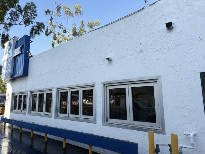 Clean stucco building after soft washing exterior in San Diego